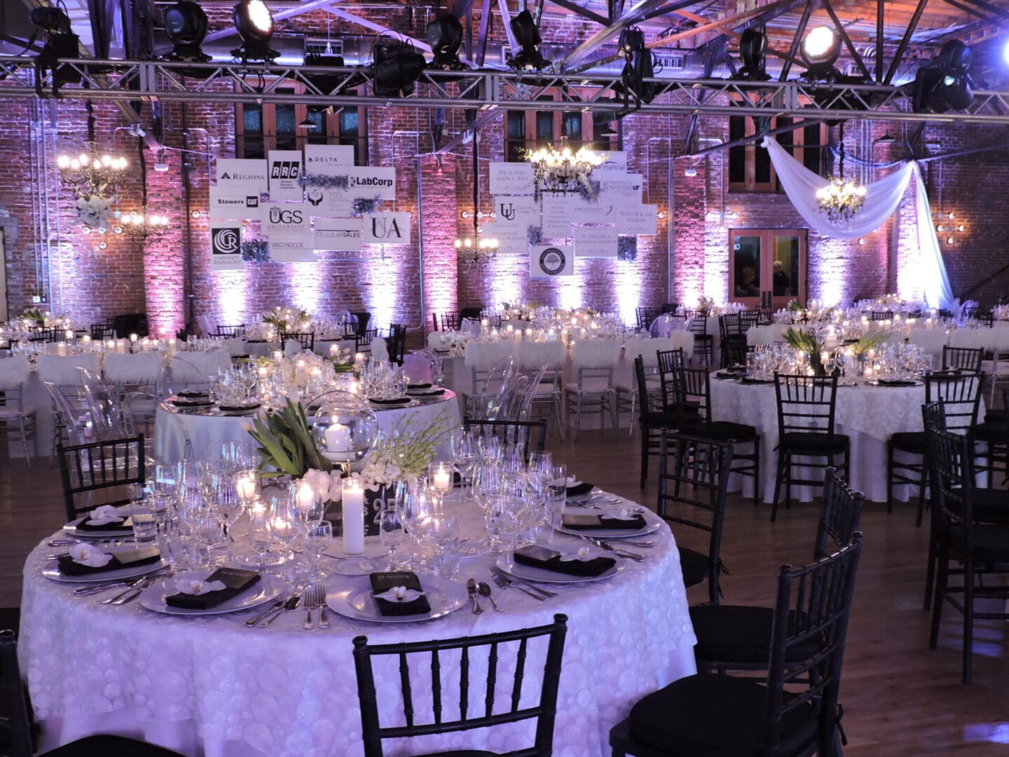 Elegant banquet hall with round tables set for a formal event.