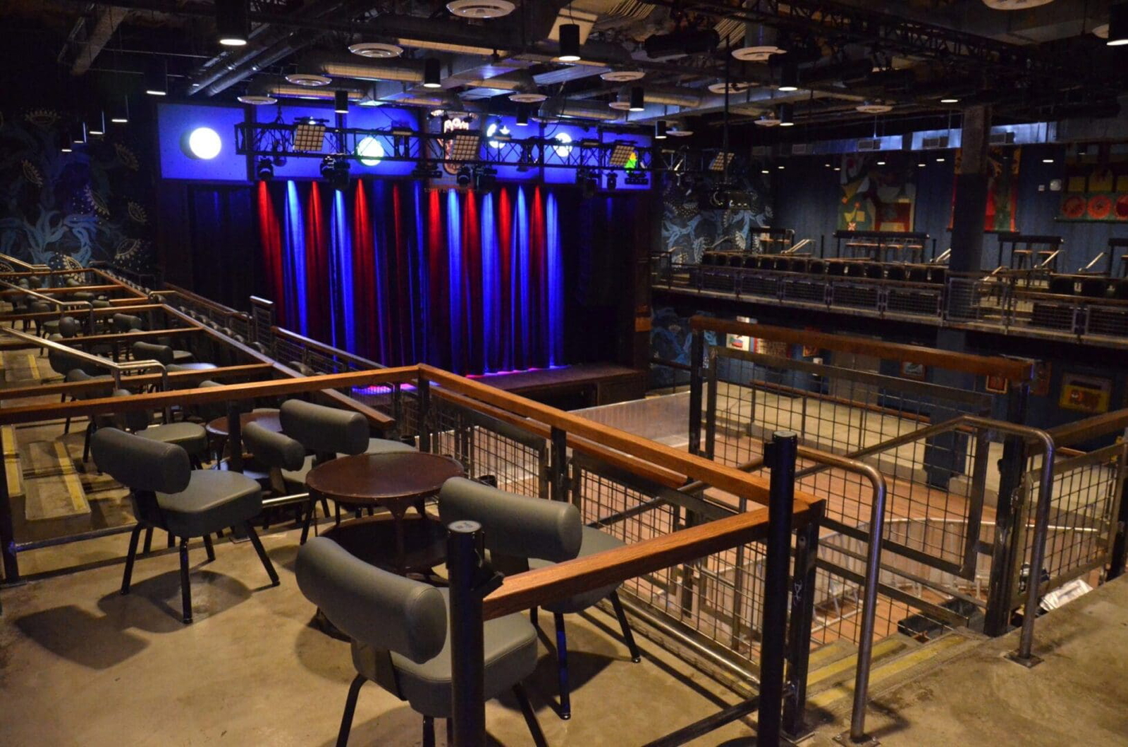 Empty theater with stage and seating areas.