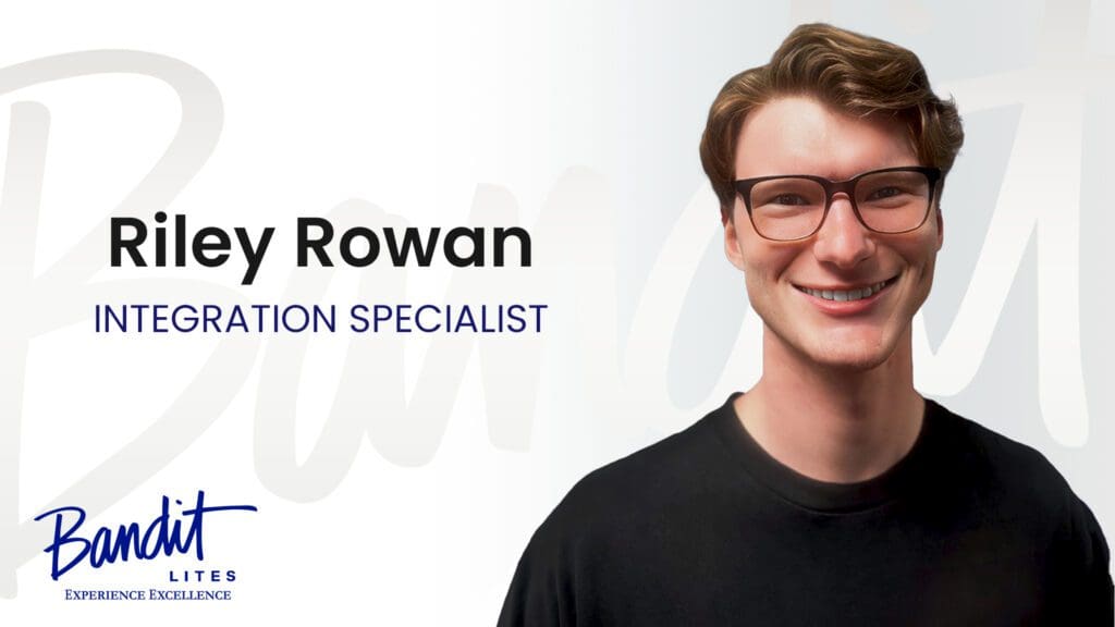 Portrait of a smiling young man with glasses, labeled as an education specialist.
