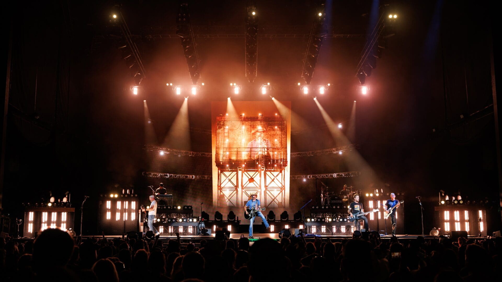 A grand stage setup with bright lights and a glowing centerpiece.