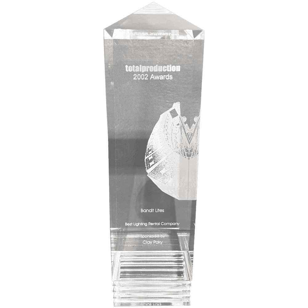 Crystal award trophy with engraved text and a figure inside.