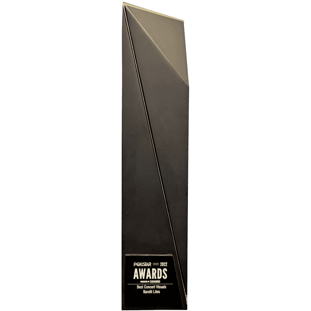 Tall black award trophy with geometric design and a gold plaque.