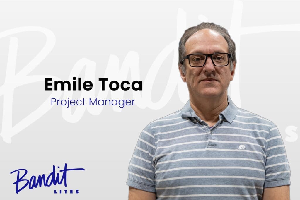 A professional man identified as Emile Toca, Project Manager, stands against a white background with a company logo.