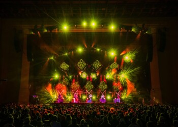 Photo: Jesse Faatz Vibrant live concert with colorful stage lights and enthusiastic crowd.